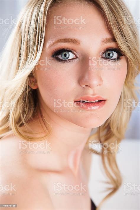 Beautiful Blonde Teenage Girl With Blue Eyes Stock Photo Download