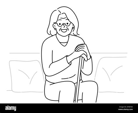 Smiling Elderly Grandmother Sit On Sofa With Walking Stick Feeling Positive And Optimistic