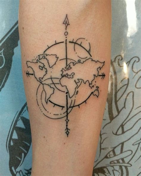 A Black And White Photo Of A Compass Tattoo On The Right Arm With A