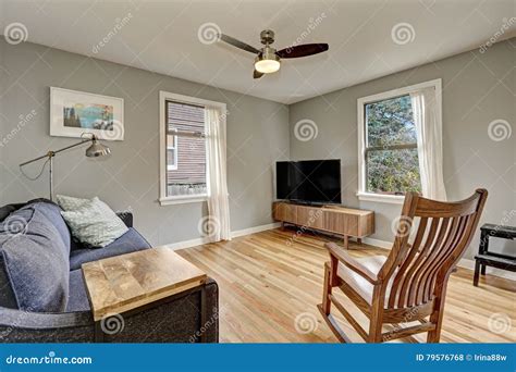 Simplistic Living Room Interior With Light Hardwood Floors Stock Photo