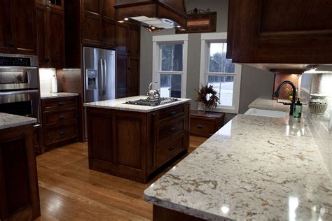 Overall, there's a lot of visual interest in this kitchen. Wonderful Wooden Range Hood Over White Granite Cambria ...