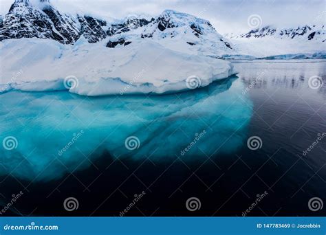 Beautiful Turquoise Ice Below Surface Glacier In Antarctica Stock Image