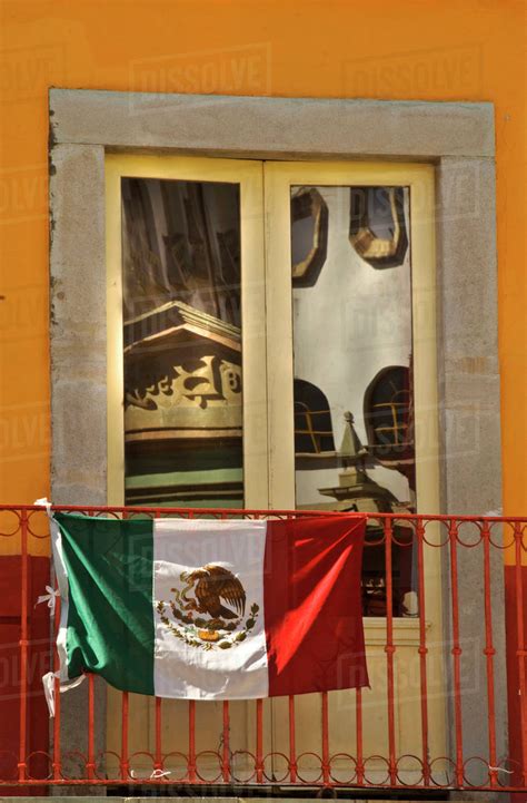 Mexico Guanajuato Mexican Flag On Rail With Reflection In Window