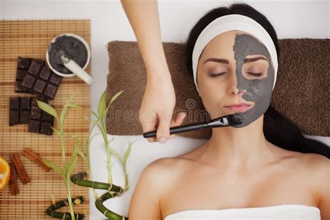 Applying Facial Mask At Woman Face At Beauty Salon Stock Image Image Of Cosmetician Cosmetic