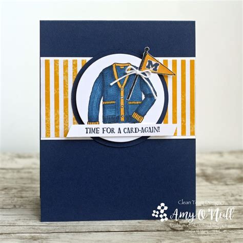 A Close Up Of A Card With A Blue Background And Yellow Stripes On The