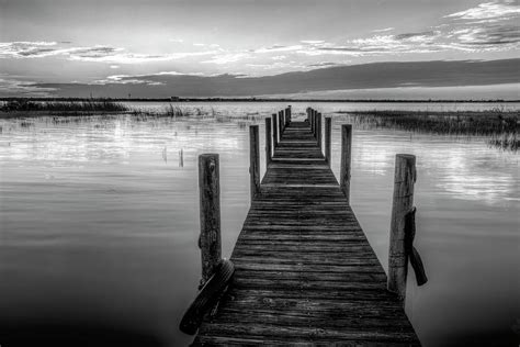Dock At Sunset In Black And White Photograph By Debra And Dave
