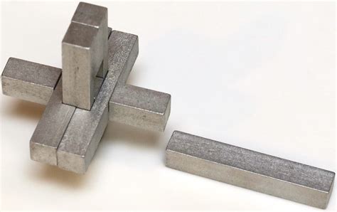 There are many six piece burr puzzles. "The Puzzle (a.k.a. Double Cross)" - Copyright J. A. Storer