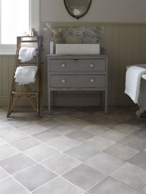 As a result, for decades, vinyl has been a popular flooring idea for bathrooms. bathroom ideas with sleek grey tile effect vinyl flooring ...