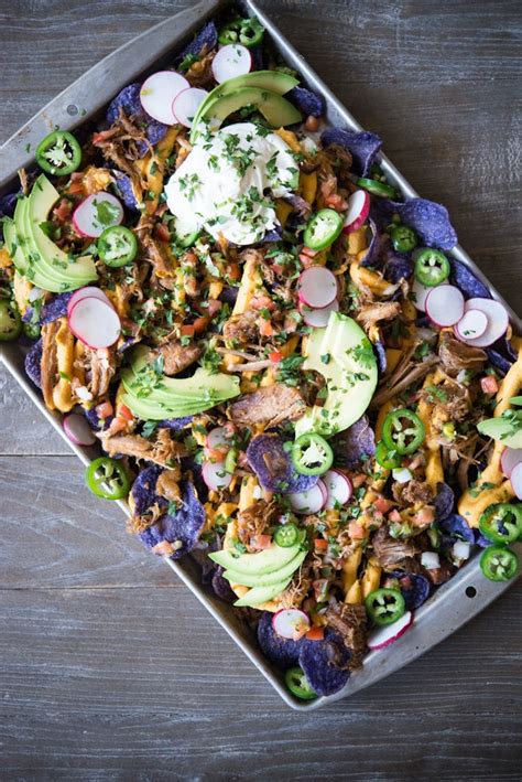 The secret to saving bland, unripe tomatoes? Loaded Carnitas Trash Can Lid Nachos | Fed & Fit