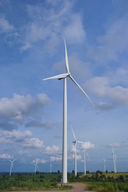 Premium Photo View Of Wind Turbine Farm Over The Blue Clouded Sky