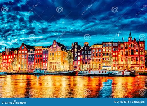 Famous Amstel River And Night View Of Beautiful Amsterdam City