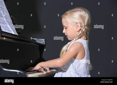 Little Girl Playing Piano Indoors Stock Photo Alamy