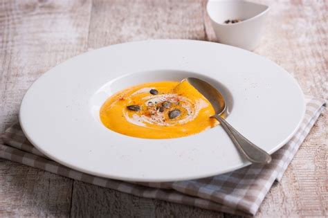 Free Photo Close Up Of Tasty Pumpkin Soup With Spoon