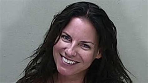 woman smiles in dui arrest mugshot after fatal crash