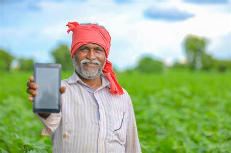 Premium Photo Indian Farmer Talking Mobile Phone At Agriculture Field