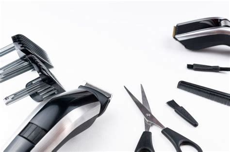 Premium Photo Scissors And Combs On White Combs Hair Clippers