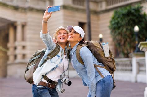 Group Of Young Hipster Tourist Friend Having Fun With Smartphone Stock