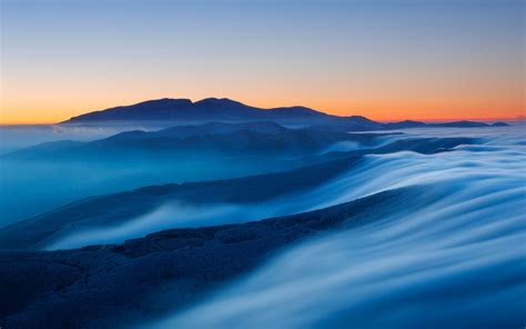 Download Wallpaper 1680x1050 Sunset Mountains Fog Horizon Landscape