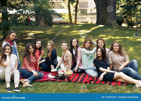 Stylish Happy Group Of Women Posing And Smiling On Picnic Sitting On Blanket Joyful Moments