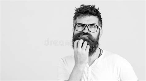 Pensive Man Touching His Beard On White Wall Handsome Man In Glasses