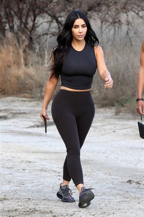 Kim Kardashian Sports A Black Crop Top And Leggings As She Steps Out