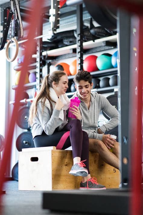 Beautiful Young Fit Couple In Modern Crossfit Gym Talking Stock Photo
