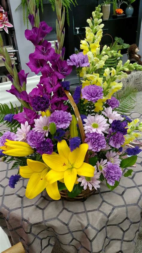 Flowers for the casket are chosen by the immediate family. A bright and beautiful basket arrangement for a funeral ...