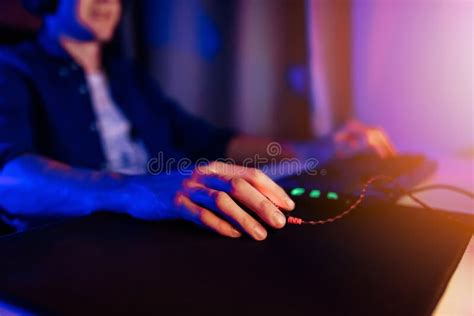 Gamer Playing Video Games On A Computer With Headphones And Using A