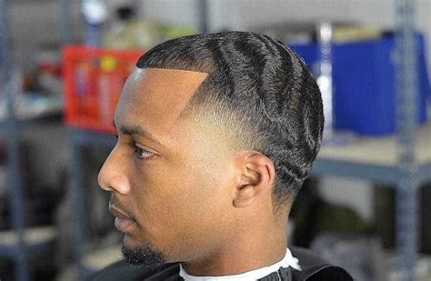 Haircut with design in the back. 12 Best Taper Fade Haircuts for Black Men Are Here