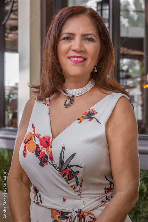 A Confident Hispanic Mature Woman Poses For A Photo Op Stock Photo Adobe Stock