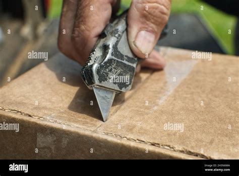 Cutting Open A Box Hi Res Stock Photography And Images Alamy