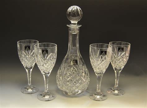 A Royal Doulton Crystal Glass Wine Decanter And Four Conforming Glasses Original Box