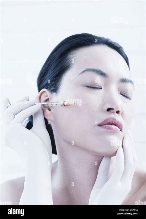 Woman Having Botox Injection In Face Stock Photo Alamy