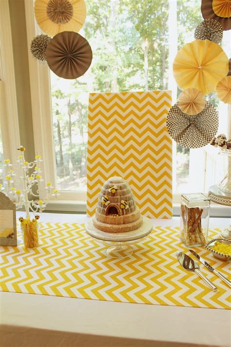 Bright yellow contrasted with black, honeycomb or striped patterns, and sweet honey flavors are all great ways to bring the bee theme to life. a gentile family: Mommy to Bee Baby Shower