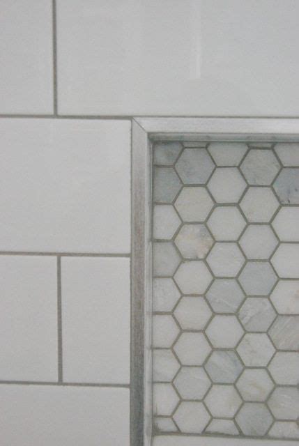 Your shower may have a type of metal trim that needs to come off. white subway tile with chair rail shower with niche ...