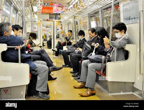 Japan Tokyo Japanese People In A Subway Train Stock Photo Alamy