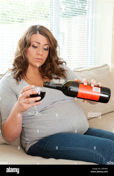 Pregnant Woman Sat On Sofa Hi Res Stock Photography And Images Alamy