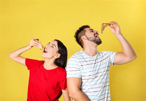 Young Couple Eating Pizza On Background Stock Image Image Of