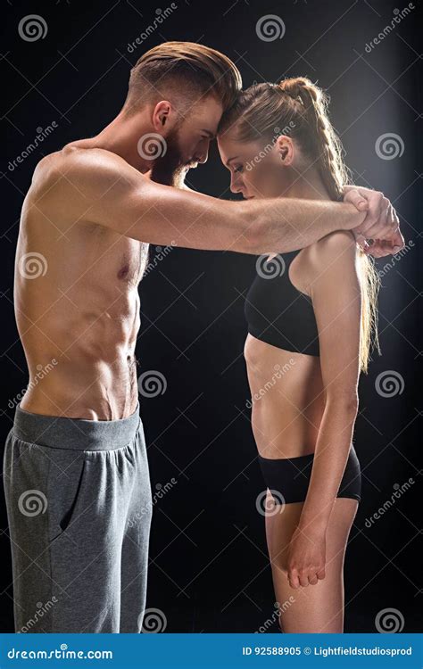 bearded sportsman and attractive sportswoman embracing isolated stock image image of gesturing