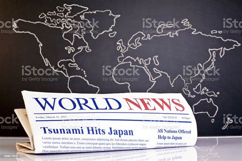 World News Newspaper In Front Of Hand Drawn Map Stock Photo Download
