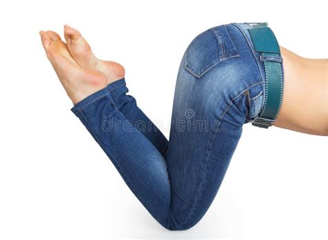 Close Up Woman Barefoot And Legs Wearing Jeans Pant On Red Sofa At Home