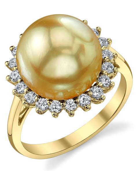 Inspired by my passion for ancient egyptian culture and mythology, this unique design combines a beautiful white pearl with a diamond on top Golden Pearl & Diamond Sage Ring
