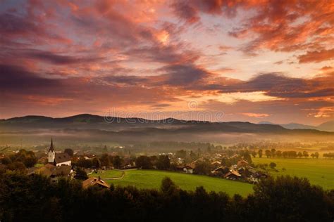 Breathtaking Morning Lansdcape Of Small Bavarian Village Covered In Fog