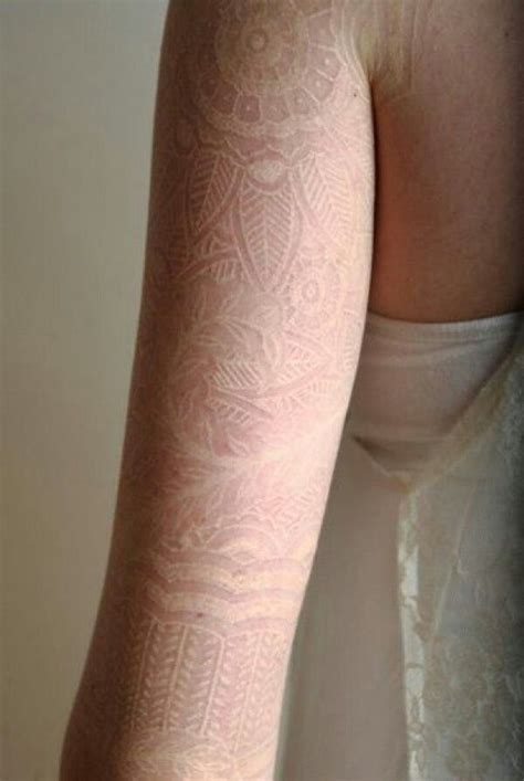 This next tattoo is one of our favorites! White ink, lace sleeve | Lace sleeve tattoos, White tattoo, Ink tattoo