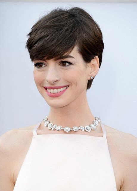 The hair is cut in a variety of messy layers to soften the line, cover a strong jawline and add width to minimise a pointed chin. Pixie haircut for thick hair