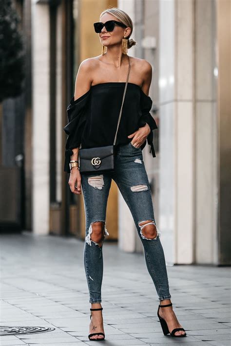 Blonde Woman Wearing Club Monaco Black Off The Shoulder Top Denim Ripped Skinny Jeans Outfit