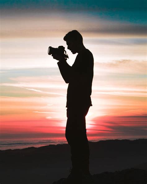 Download Man Holding A Camera Silhouette Profile Wallpaper