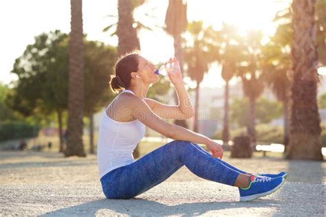 Female Runner Drinking Water After Exercise Stock Photo Image Of
