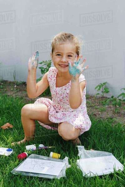 Happy Babe Girl Playing With Paint In Garden Stock Photo Dissolve