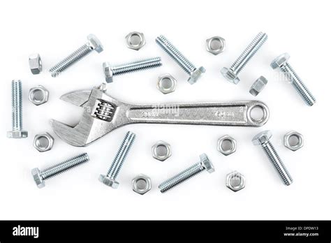Adjustable Wrench With Screws And Nuts On White Background Stock Photo